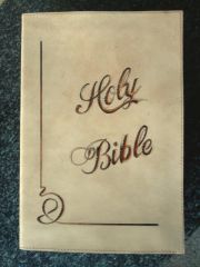 Bible cover. Done with a swivel knife and a little colour :-) I was one lazy leatherworker haha!!