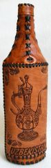 Decorative bottle in leather. Uzbekistan souvenir.