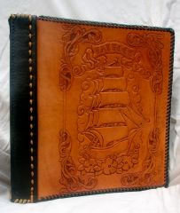 hand tooled, 3 ring binder style artist's portfolio or photo album