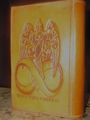 tooled leather three peice bible cover for the Crow family (back)