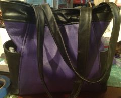 First machine-sewn purse