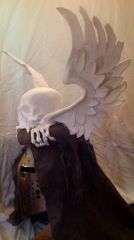 Winged skull helm crest