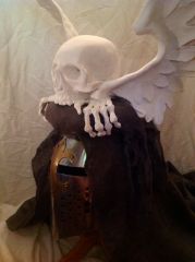 Winged skull helm crest