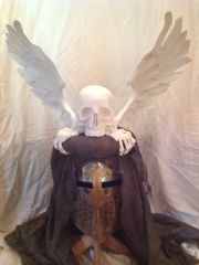Winged skull helm crest
