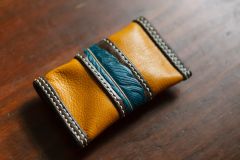small feather pouch