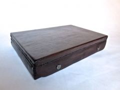 Leather presentation case for a Taurus "The Judge" revolver.