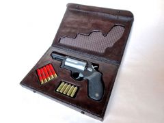 Leather presentation case for a Taurus "The Judge" revolver.