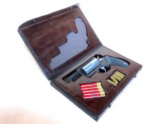 Leather presentation case for a Taurus "The Judge" revolver.