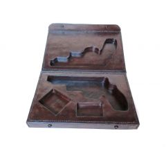 Leather presentation case for a Taurus "The Judge" revolver.