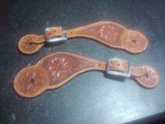 Spur straps donated to Old Settler's Reunion group for auction