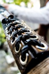 Handmade bow with tooled leather