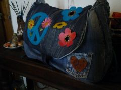 embroidered jeans And leather bag
