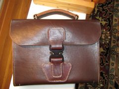 Thick latigo briefcase with quick release buckle
