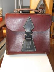 Small briefcase, cobra buckle, archery inspired.