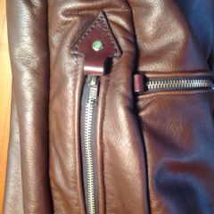 Golf bag stitching near zips