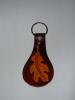 Leather_49___Oakleaf_Keychain_by_SchuldigTheRed.jpg