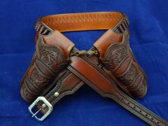 Tapered belt with scroll carved holsters