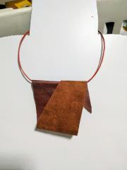 casually folded necktie , necklace