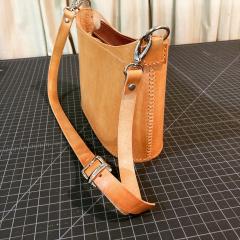 Veg-tan hand stitched purse.jpg